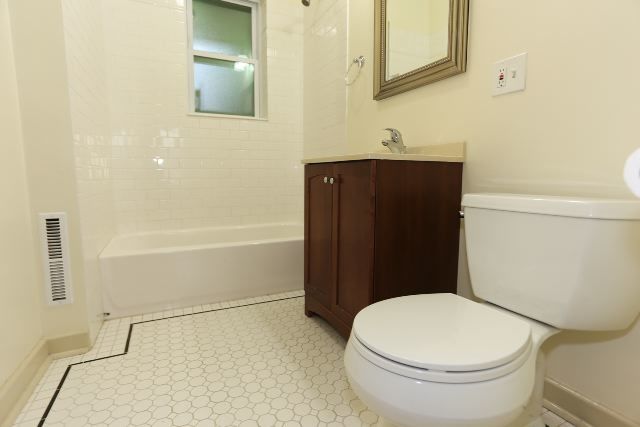 4716 North Racine Avenue, Unit 2E Chicago, IL 60640 - Photo 18 of 19 a bathroom with a toilet and a shower