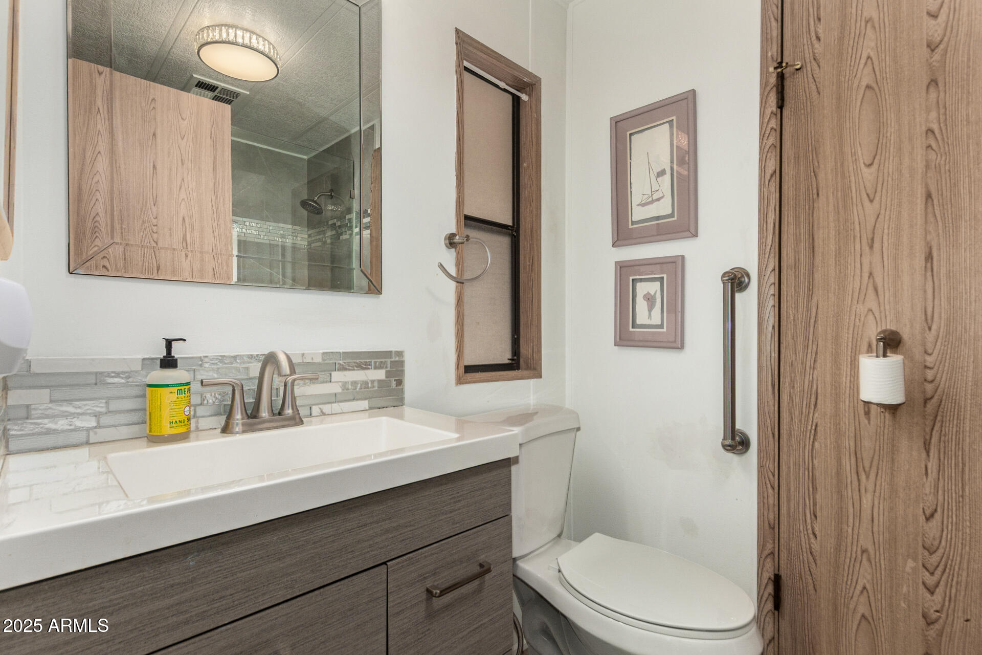 301 South Signal Butte Road, Unit 706 Apache Junction, AZ 85120 - Photo 27 of 48 a bathroom with a sink a toilet and shower