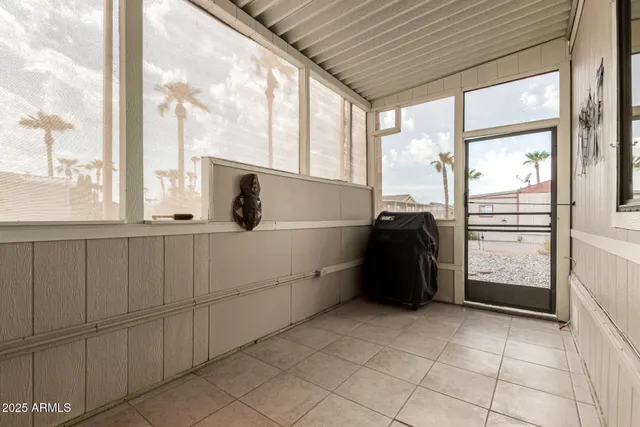a kitchen with a window and refrigerator