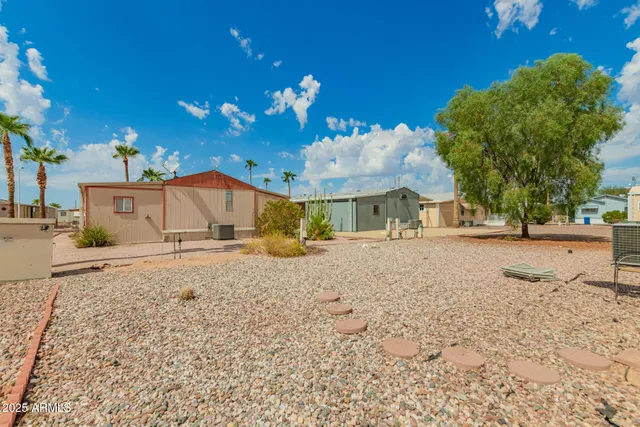 a view of road with large trees