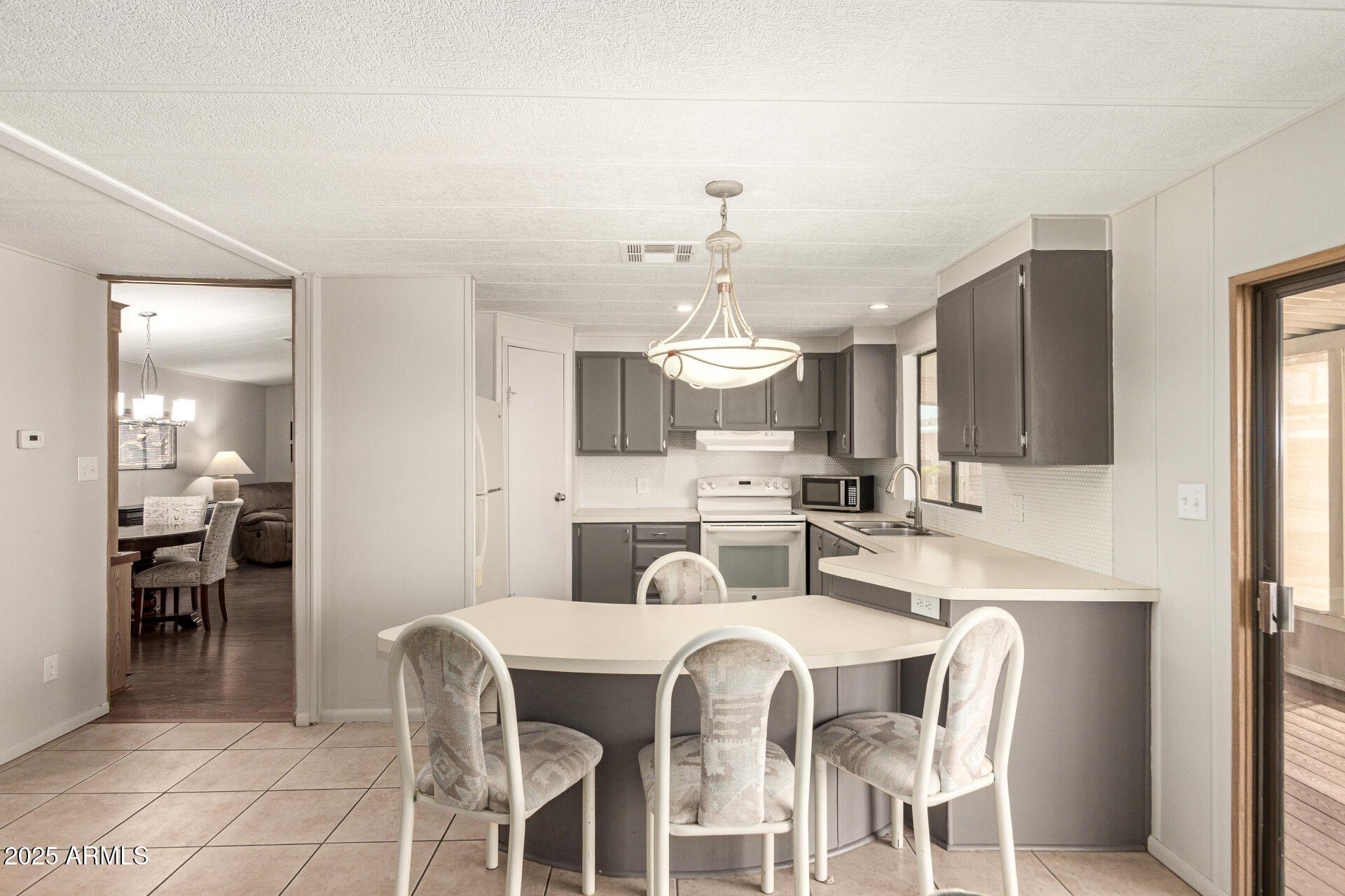 301 South Signal Butte Road, Unit 706 Apache Junction, AZ 85120 - Photo 3 of 48 a view of a dining room with furniture