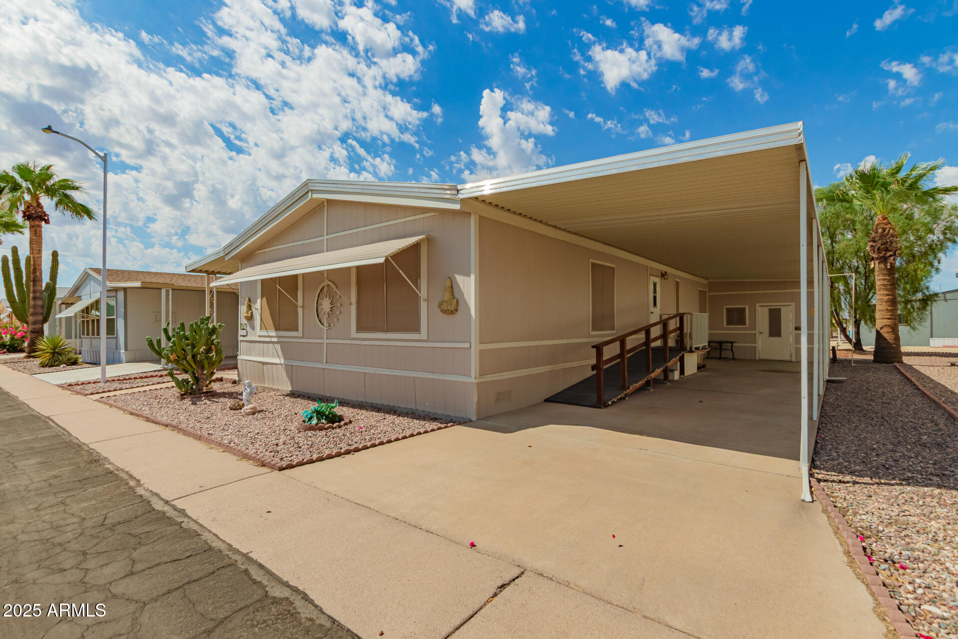 301 South Signal Butte Road, Unit 706 Apache Junction, AZ 85120 - Photo 6 of 48 a view of garage and yard