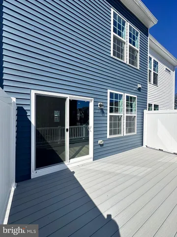 a front view of a house with large windows