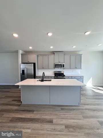 a view of a living room filled with furniture