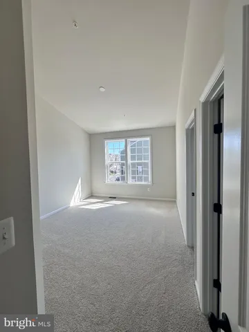 a spacious bathroom with a double vanity sink toilet mirror and shower