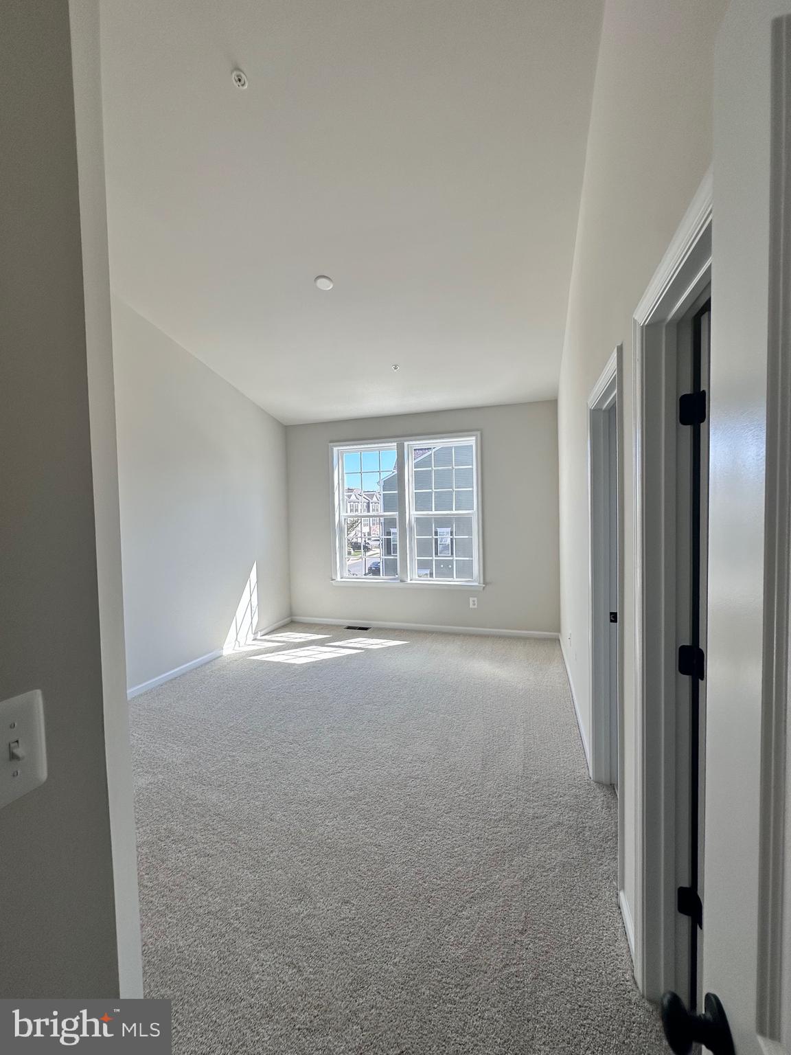 108 Spring Bank Way Frederick, MD 21701 - Photo 10 of 19 a view of an empty room with a window
