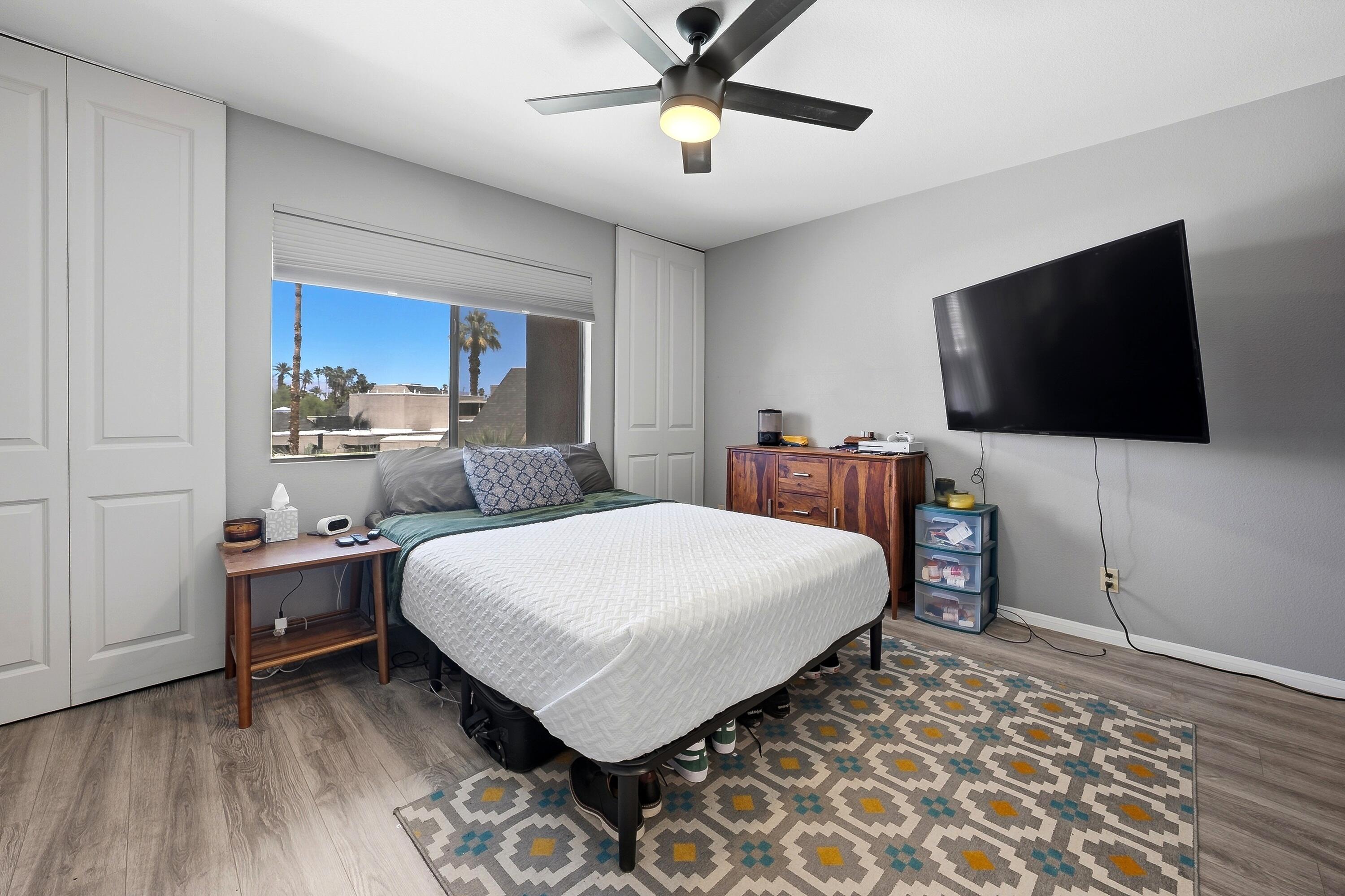 71870 Eleanora Lane Rancho Mirage, CA 92270 - Photo 16 of 36 a bedroom with a bed and a flat screen tv