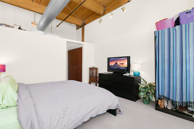 1500 West Monroe Street, Unit 225 Chicago, IL 60607 - Photo 14 of 23 a bedroom with a bed and a television