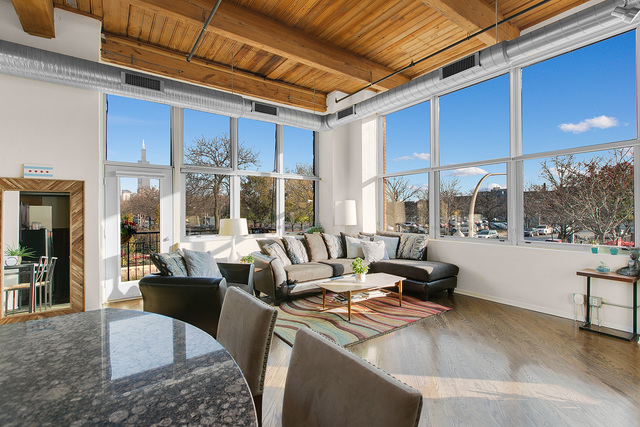1500 West Monroe Street, Unit 225 Chicago, IL 60607 - Photo 3 of 23 a living room with fireplace furniture and a large window