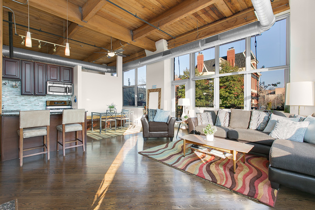 1500 West Monroe Street, Unit 225 Chicago, IL 60607 - Photo 7 of 23 a living room with furniture wooden floor and a table