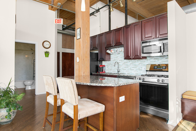 1500 West Monroe Street, Unit 225 Chicago, IL 60607 - Photo 9 of 23 a kitchen with stainless steel appliances granite countertop a stove refrigerator sink and cabinets