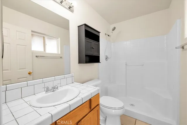 a bathroom with a toilet and a bathtub
