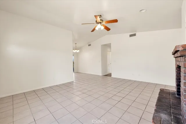 a kitchen with stainless steel appliances granite countertop a sink a stove and a window