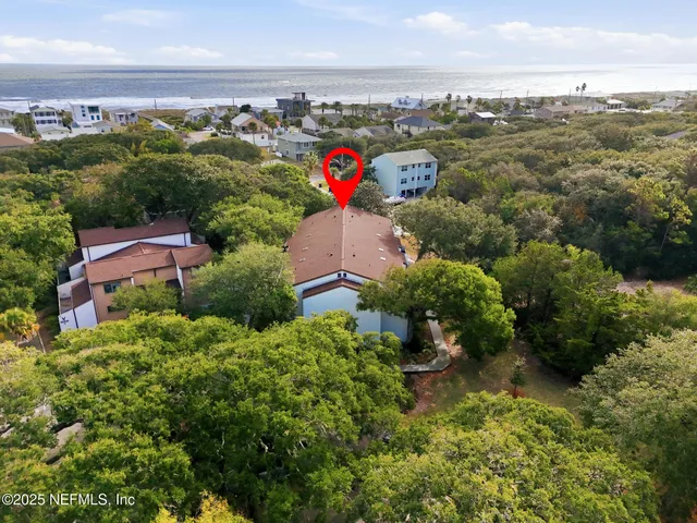 a view of a house with swimming pool and sitting area