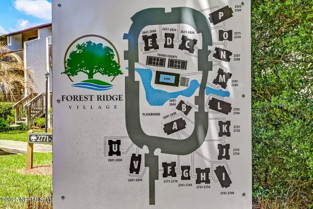 a view of swimming pool with a garden and trees