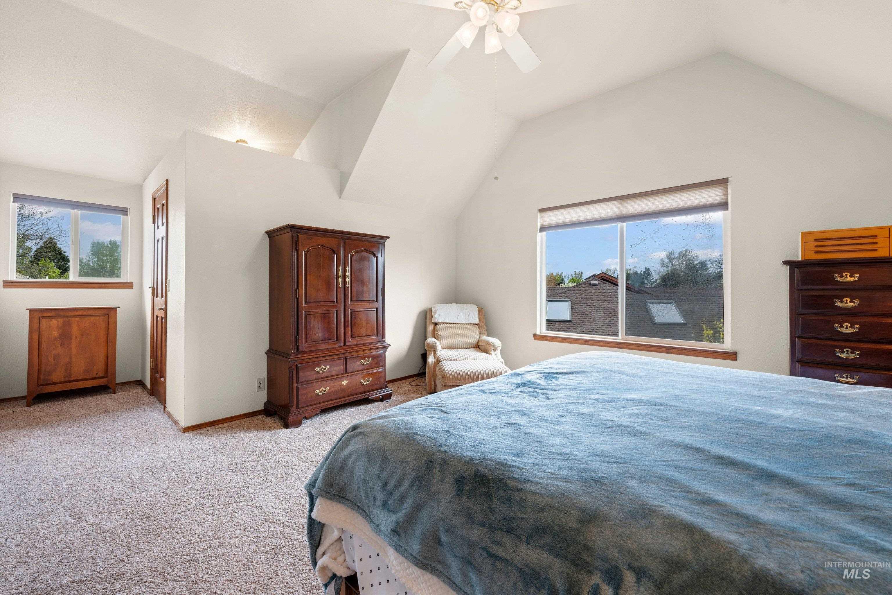 1921 Incline Way Meridian, ID 83646 - Photo 28 of 50 Vaulted ceiling room featuring light-toned carpeting and multiple windows with wood sills