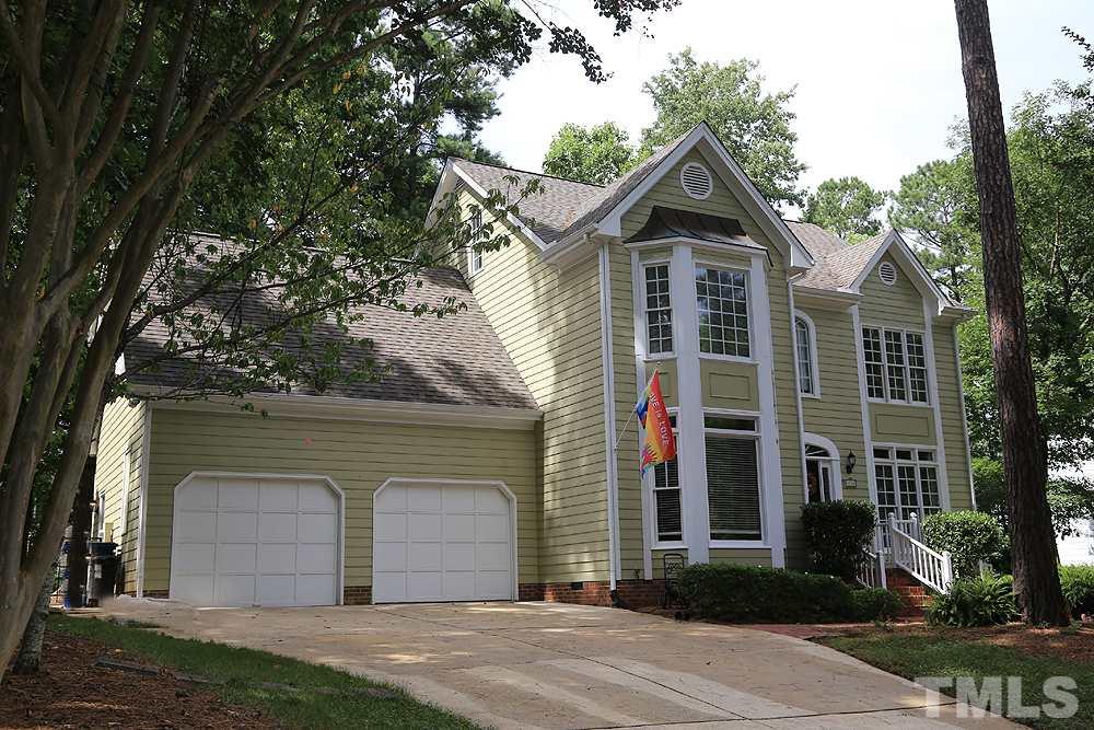 4008 Skipjack Court Raleigh, NC 27613 - Photo 1 of 21 a front view of a house with a yard and garage