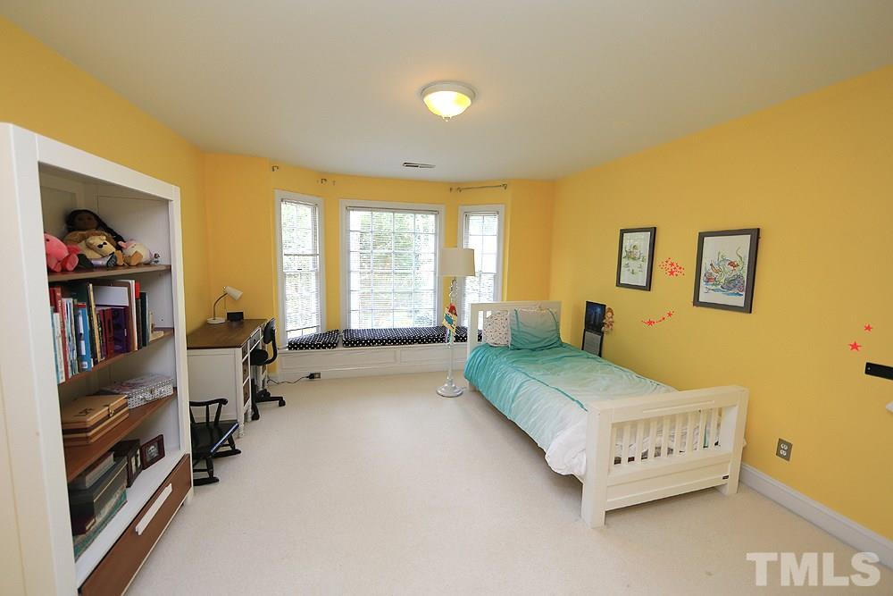 4008 Skipjack Court Raleigh, NC 27613 - Photo 14 of 21 a bedroom with a bed and wooden floor