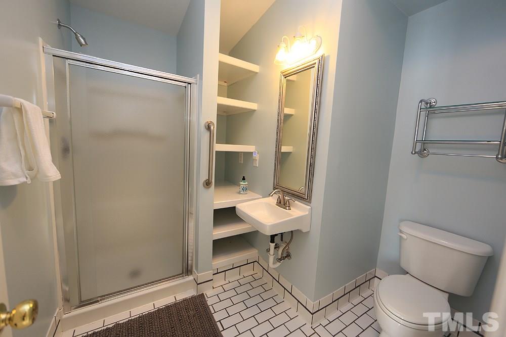 4008 Skipjack Court Raleigh, NC 27613 - Photo 16 of 21 a bathroom with a toilet and a shower