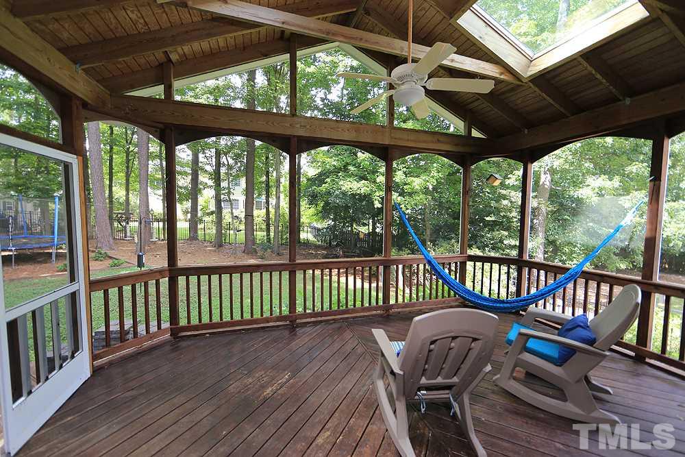 4008 Skipjack Court Raleigh, NC 27613 - Photo 19 of 21 a view of a chair in wooden deck