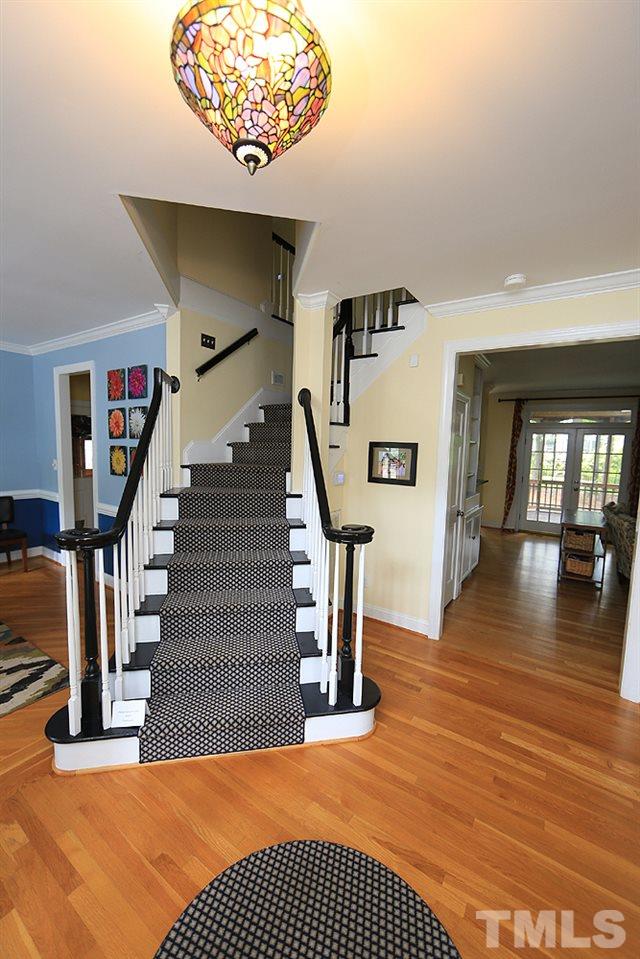 4008 Skipjack Court Raleigh, NC 27613 - Photo 3 of 21 a view of entryway and hall with wooden floor