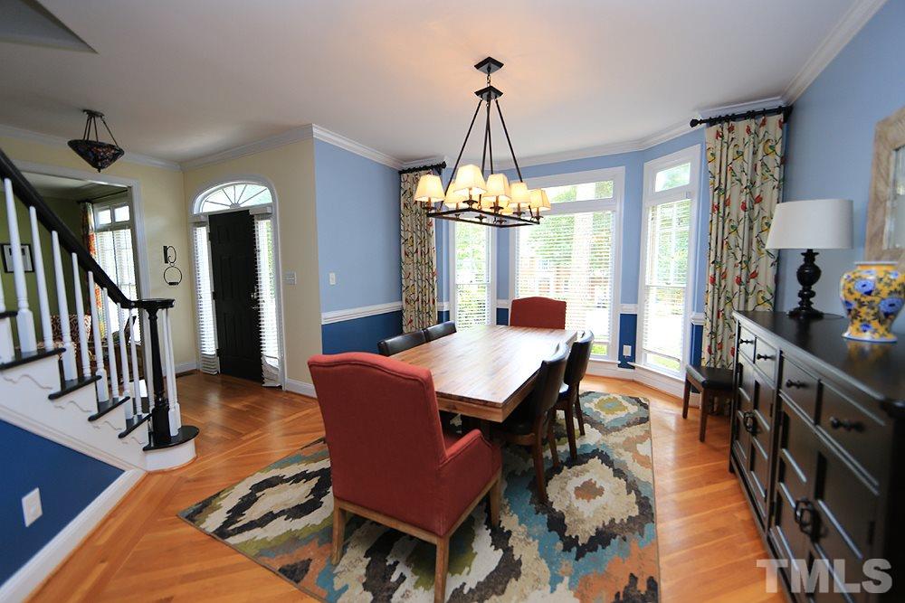 4008 Skipjack Court Raleigh, NC 27613 - Photo 5 of 21 a view of a dining room with furniture and chandelier