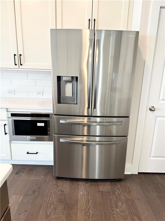 1237 Waldon Crossing Cumming, GA 30041 - Photo 28 of 29 a kitchen with stainless steel appliances a refrigerator and a cabinets