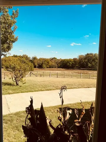a kitchen with stainless steel appliances granite countertop a sink and a refrigerator