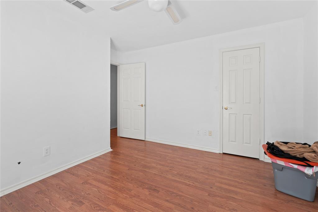 3506 Ruidoso Drive Arlington, TX 76017 - Photo 34 of 37 Spacious interior room featuring wood-finish flooring, white walls, and a ceiling fan