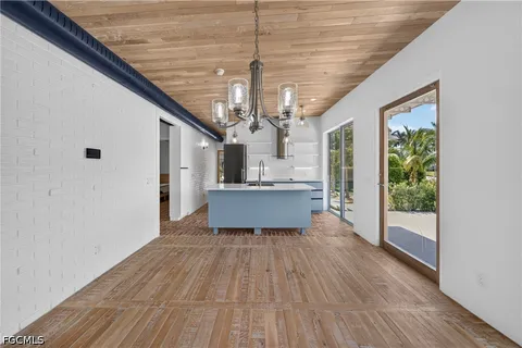 a view of a house with wooden floor and windows