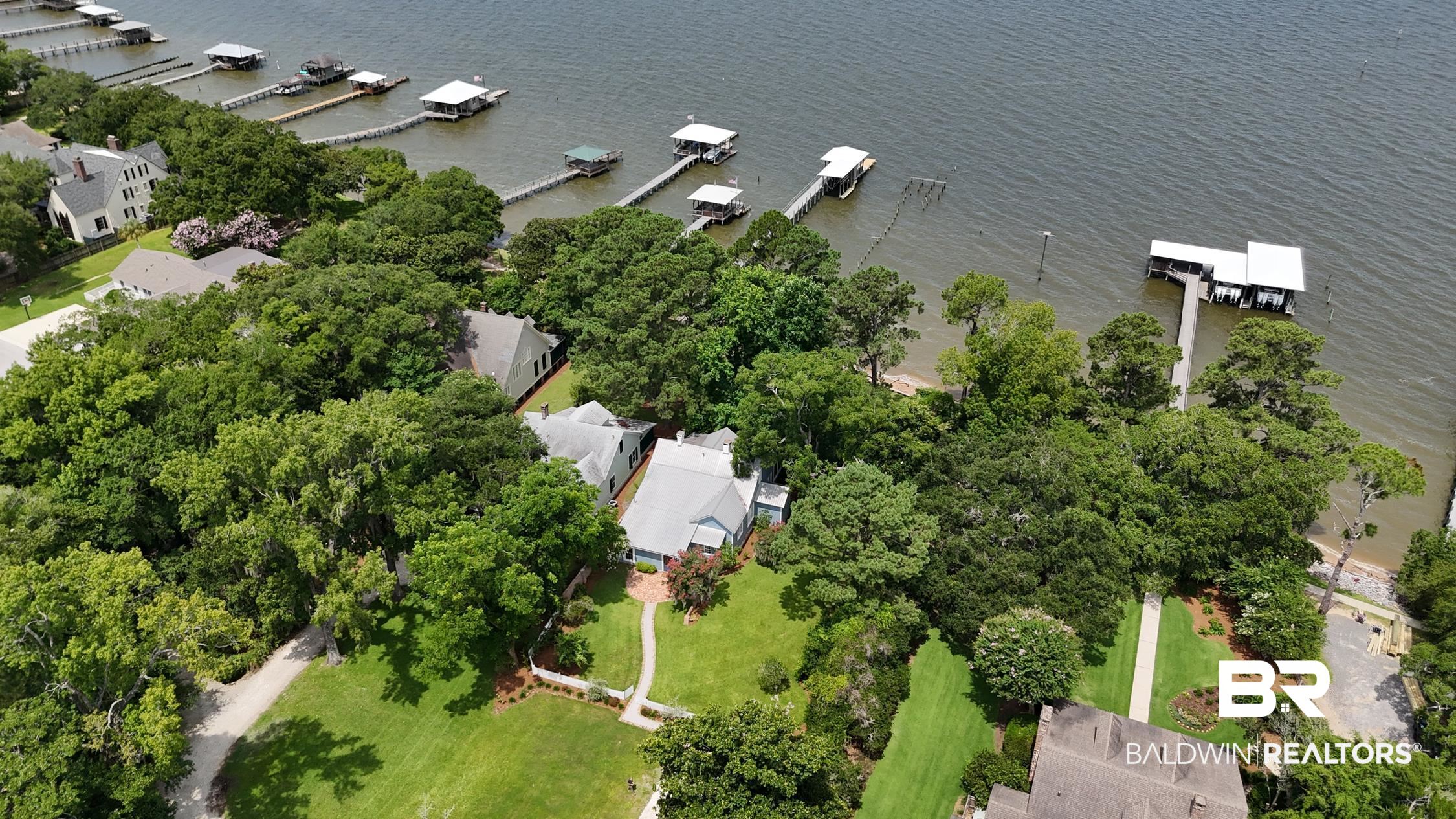 5480 Battles Road Fairhope, AL 36532 - Photo 47 of 48 Waterfront property featuring extensive tree coverage and multiple private boat slips