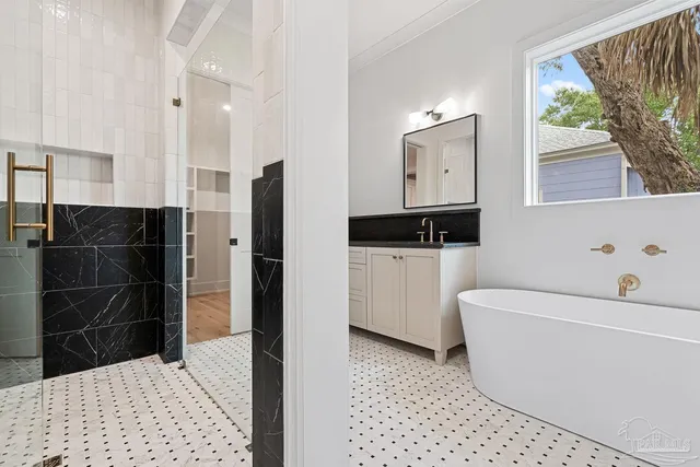 a white toilet sitting next to a bath tub