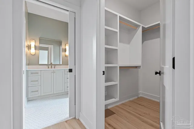 a bathroom with a sink a vanity and a mirror