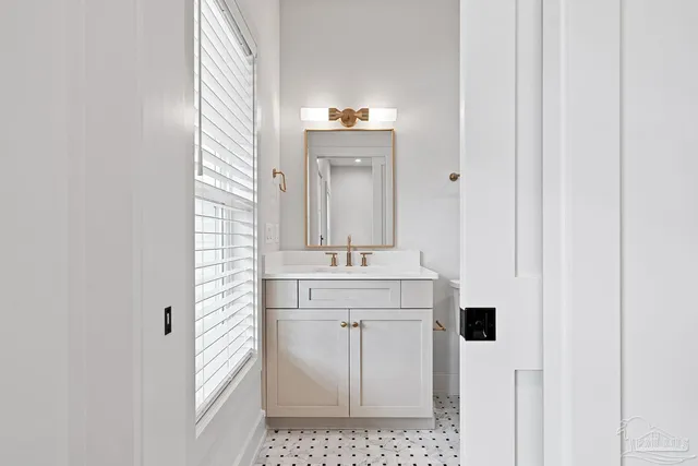 a view of white house with a yard