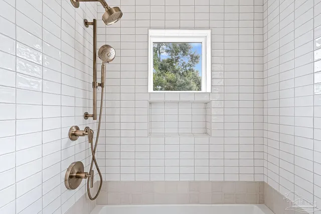 a view of a house with backyard and trees