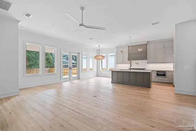 a kitchen with granite countertop a stove and a sink