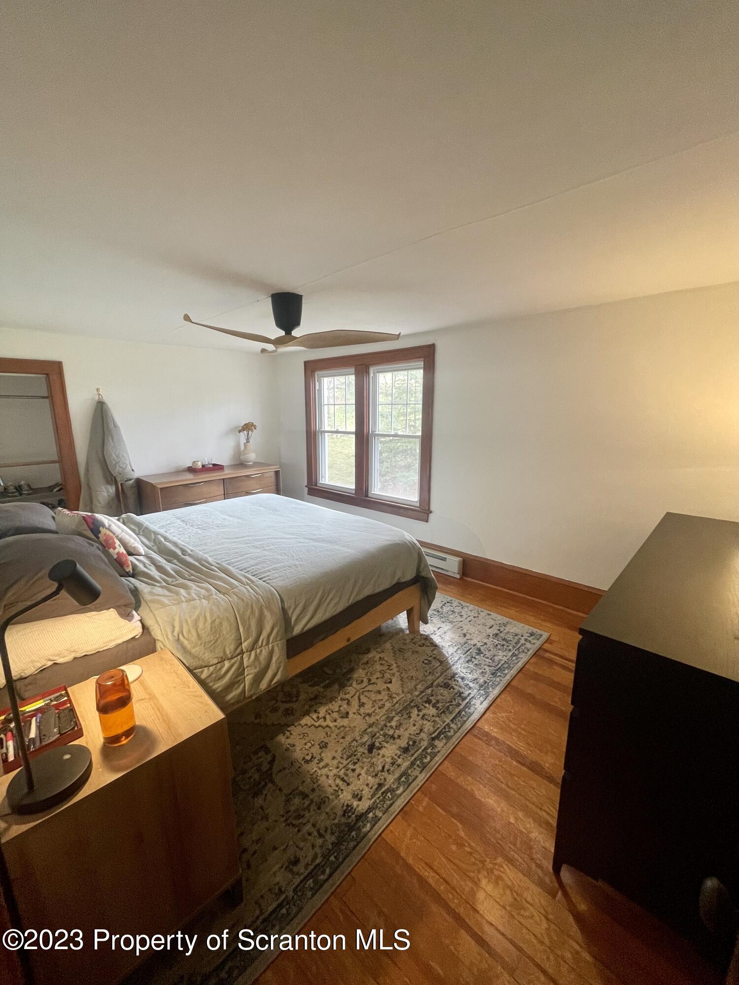 371 Bodle Road Wyoming, PA 18644 - Photo 11 of 17 a bedroom with a bed and a flat tv screen on the dresser