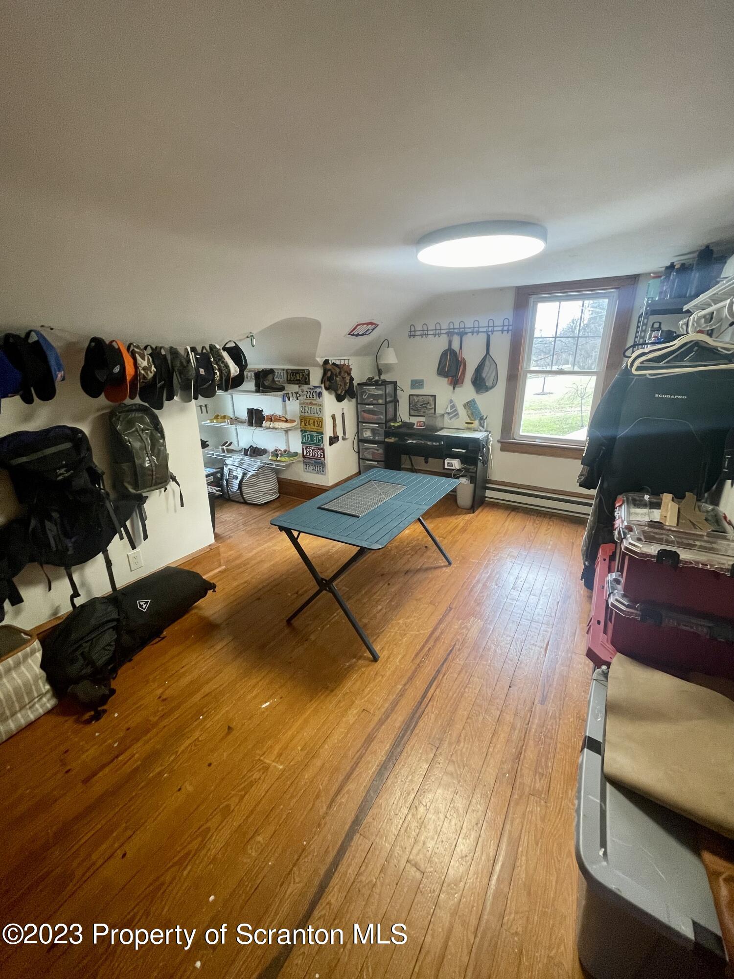 371 Bodle Road Wyoming, PA 18644 - Photo 13 of 17 a living room with furniture and a flat screen tv