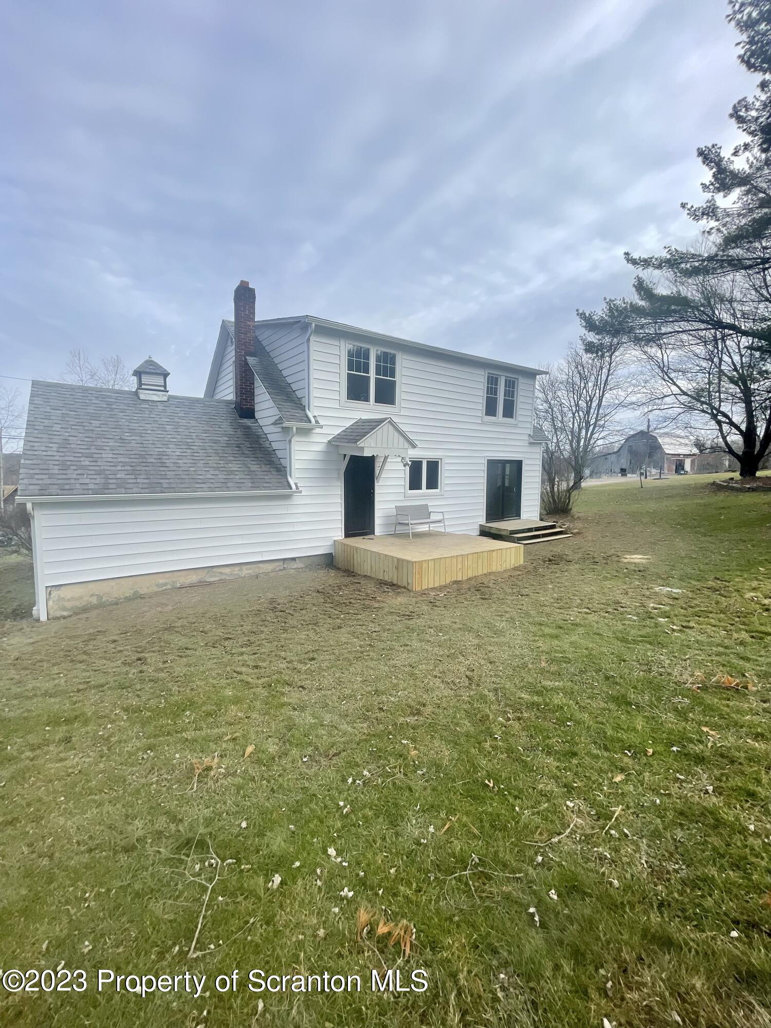371 Bodle Road Wyoming, PA 18644 - Photo 15 of 17 a house view with swimming pool in front of it