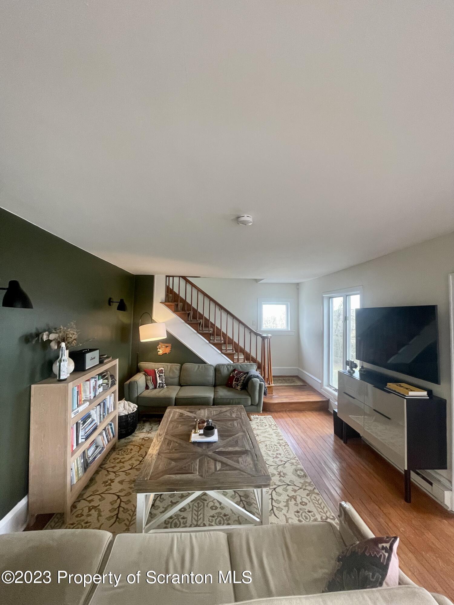 371 Bodle Road Wyoming, PA 18644 - Photo 2 of 17 a living room with furniture and a flat screen tv
