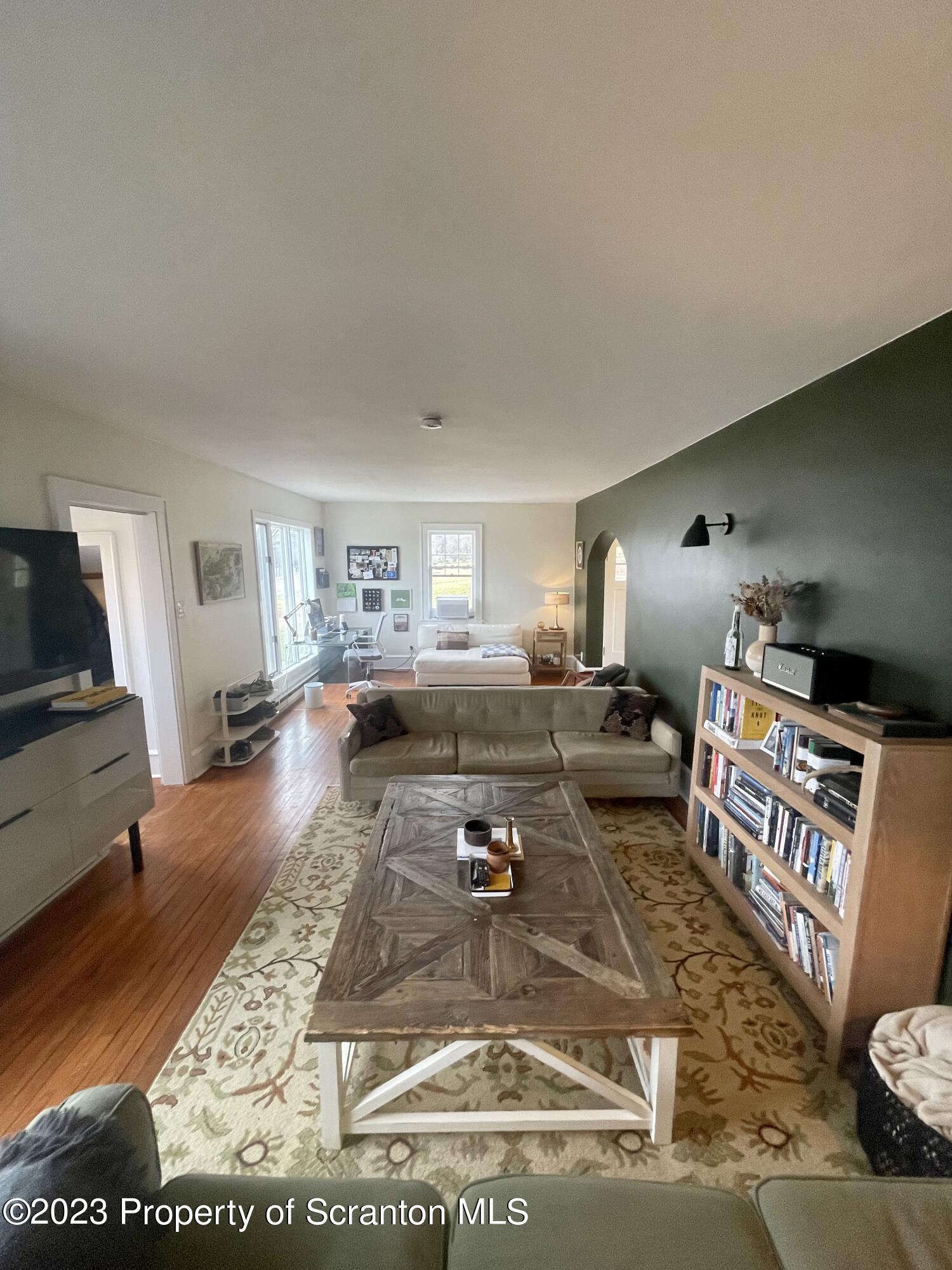 371 Bodle Road Wyoming, PA 18644 - Photo 3 of 17 a living room with furniture and a flat screen tv