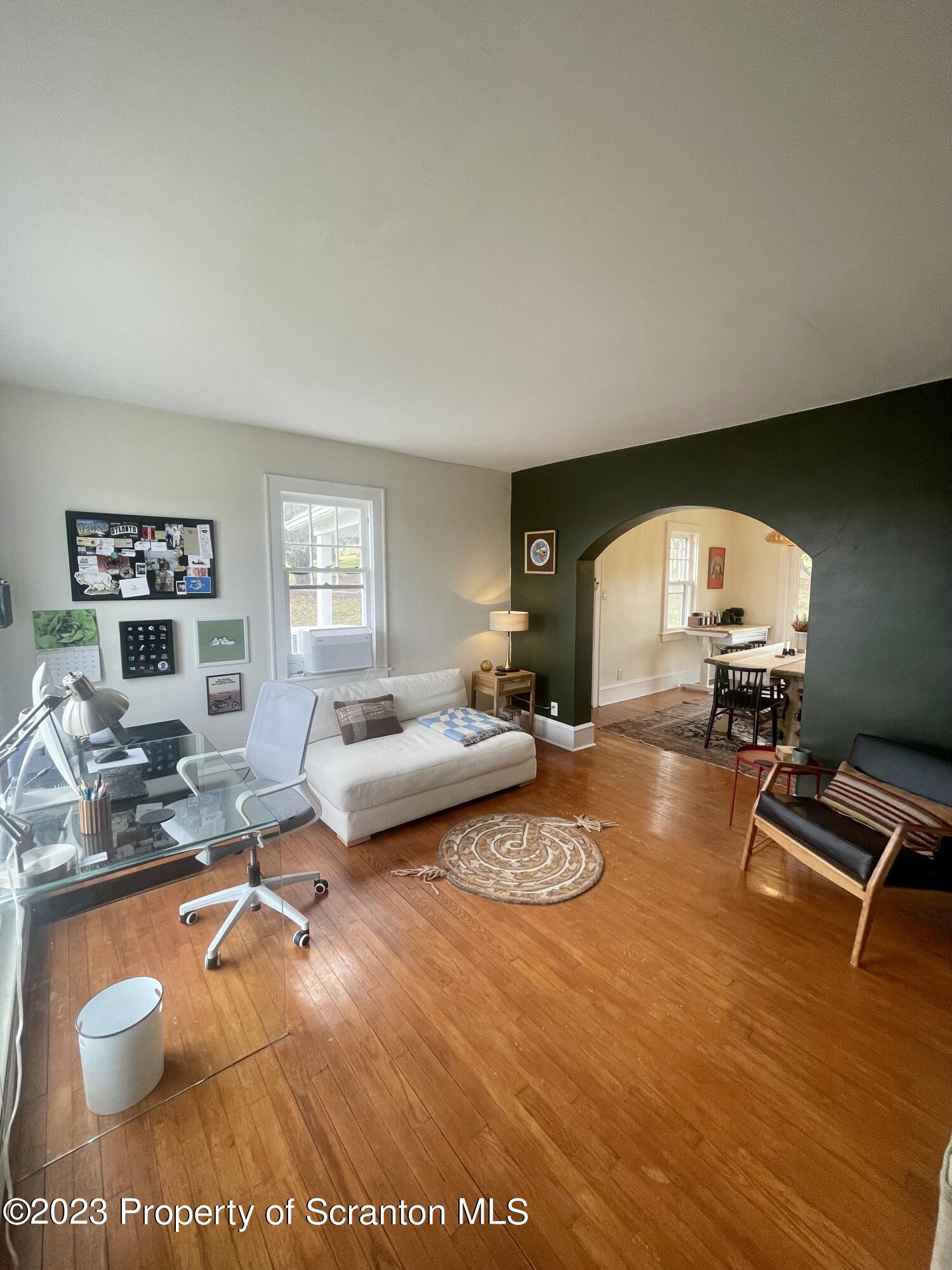 371 Bodle Road Wyoming, PA 18644 - Photo 4 of 17 a living room with furniture and a wooden floor