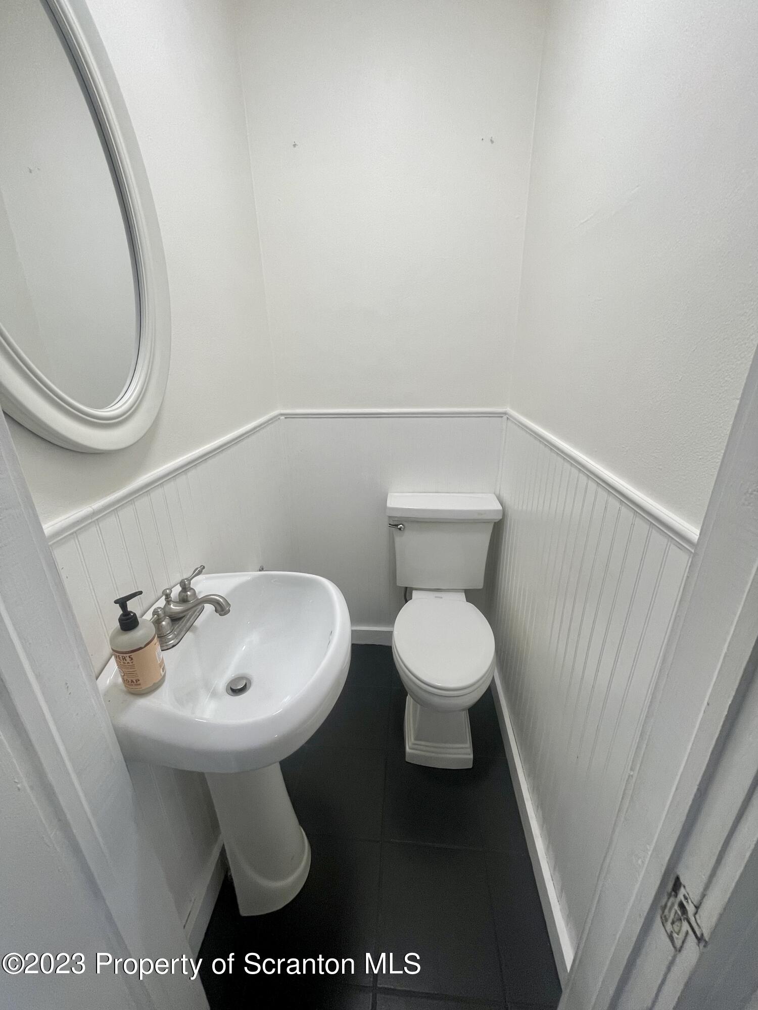 371 Bodle Road Wyoming, PA 18644 - Photo 8 of 17 a bathroom with a sink and a toilet