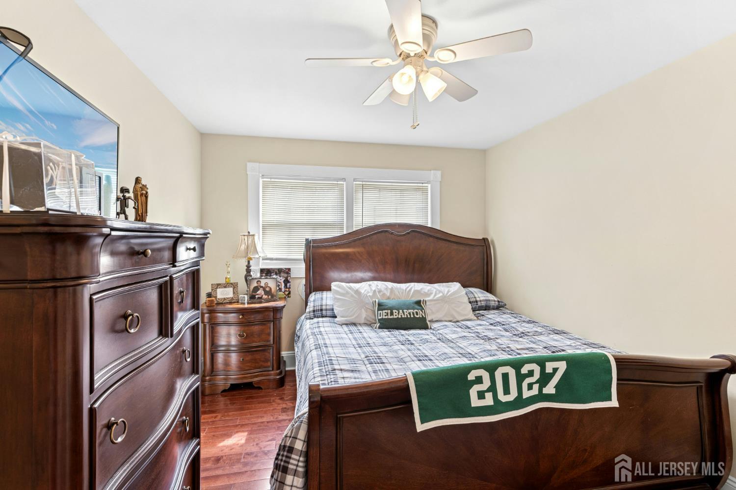 1701 Raritan Road Scotch Plains, NJ 07076 - Photo 17 of 31 a kitchen with kitchen island granite countertop a stove a sink and a microwave