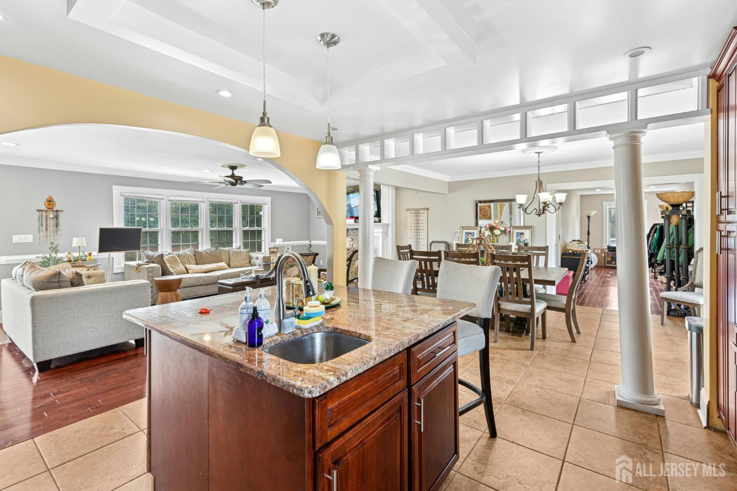 1701 Raritan Road Scotch Plains, NJ 07076 - Photo 2 of 31 a dining hall with stainless steel appliances kitchen island granite countertop a table and chairs in it