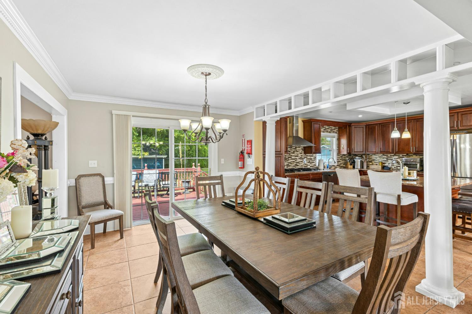 1701 Raritan Road Scotch Plains, NJ 07076 - Photo 26 of 31 a dining room with furniture a chandelier and wooden floor