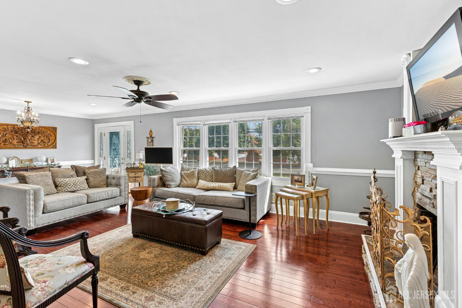 1701 Raritan Road Scotch Plains, NJ 07076 - Photo 27 of 31 a living room with furniture fireplace and flat screen tv