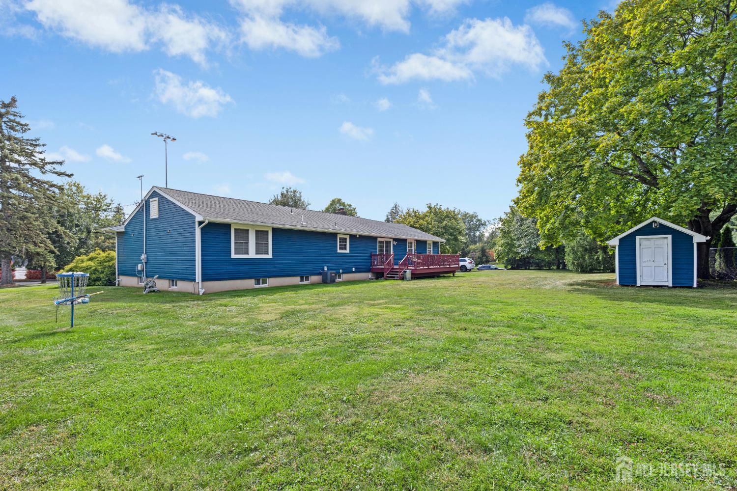 1701 Raritan Road Scotch Plains, NJ 07076 - Photo 5 of 31 a front view of a house with a garden