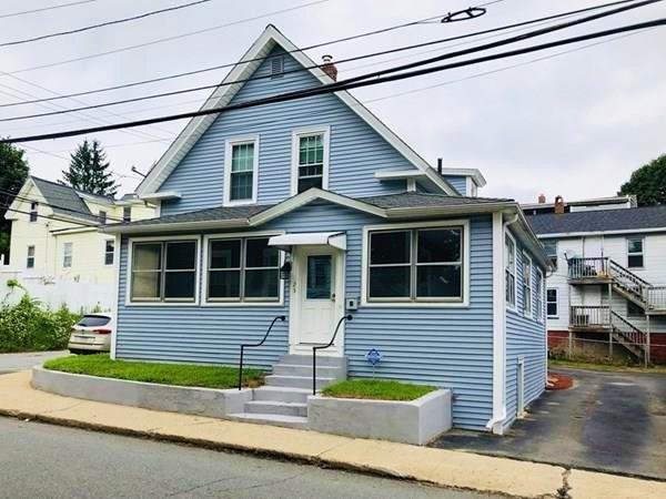 25 Baker Street Gardner, MA 01440 - Photo 1 of 26 a front view of a house with a yard and garage