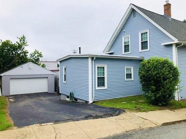 25 Baker Street Gardner, MA 01440 - Photo 3 of 26 a view of a house with a yard and plants